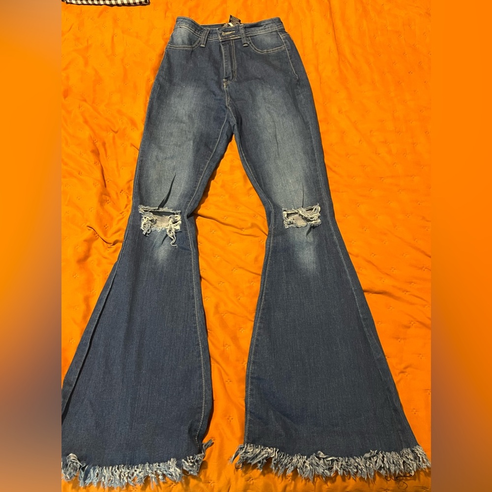 High waisted distressed bell bottom jeans